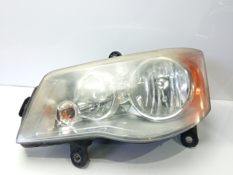 Recambio de faro izquierdo para chrysler grand voyager referencia OEM IAM 05113337AE  